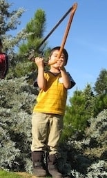 kid cut tree