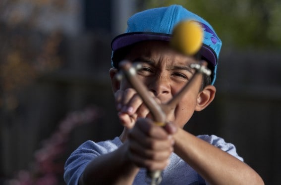 boy with slingshot from carlcostas.com